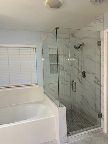 a white bath tub sitting next to a window