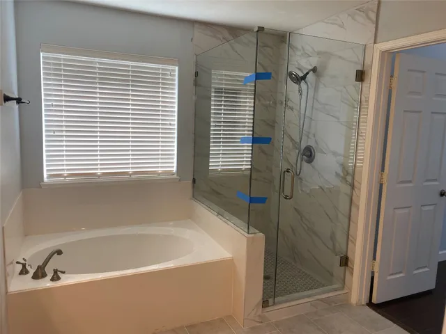 a white bath tub sitting next to a window