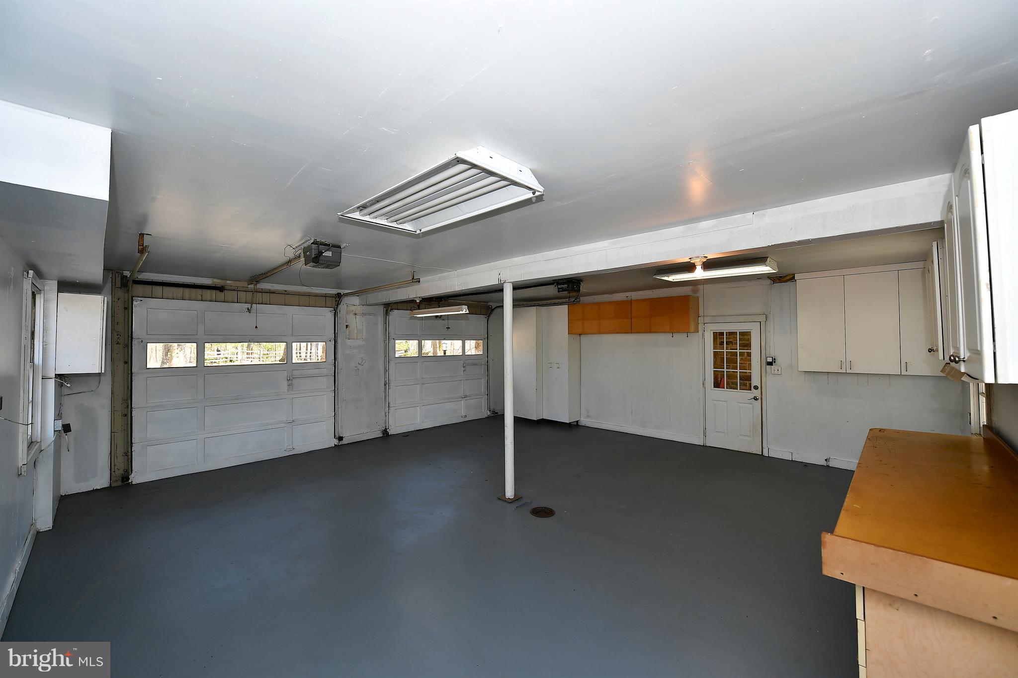 16528 Dubbs Road Sparks, MD 21152 - Photo 27 of 30 Very Large 2 Car Garage w/ Workshop Space