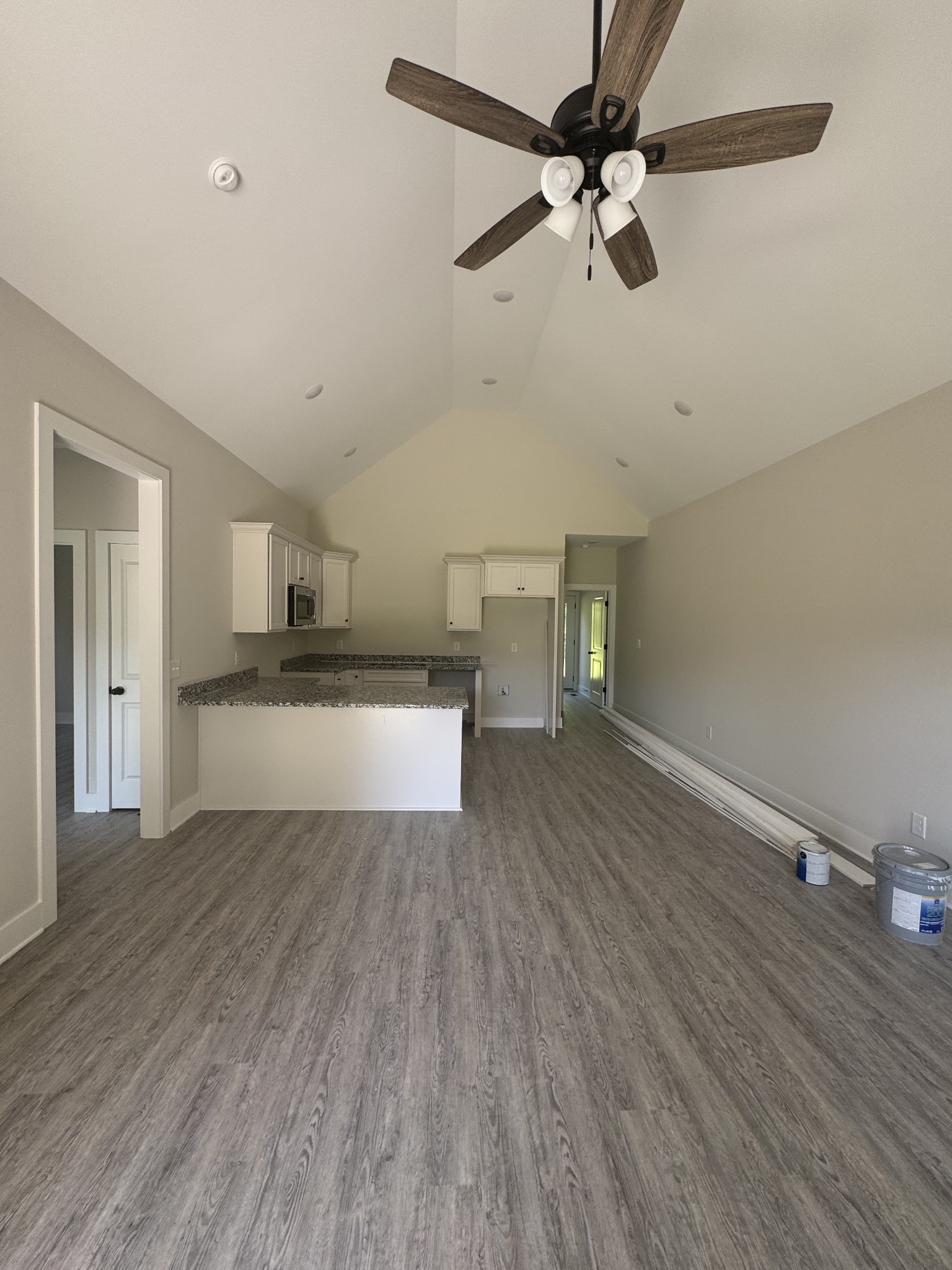 422 Shady Hill Road Dickson, TN 37055 - Photo 6 of 15 a view of kitchen and empty room with wooden floor