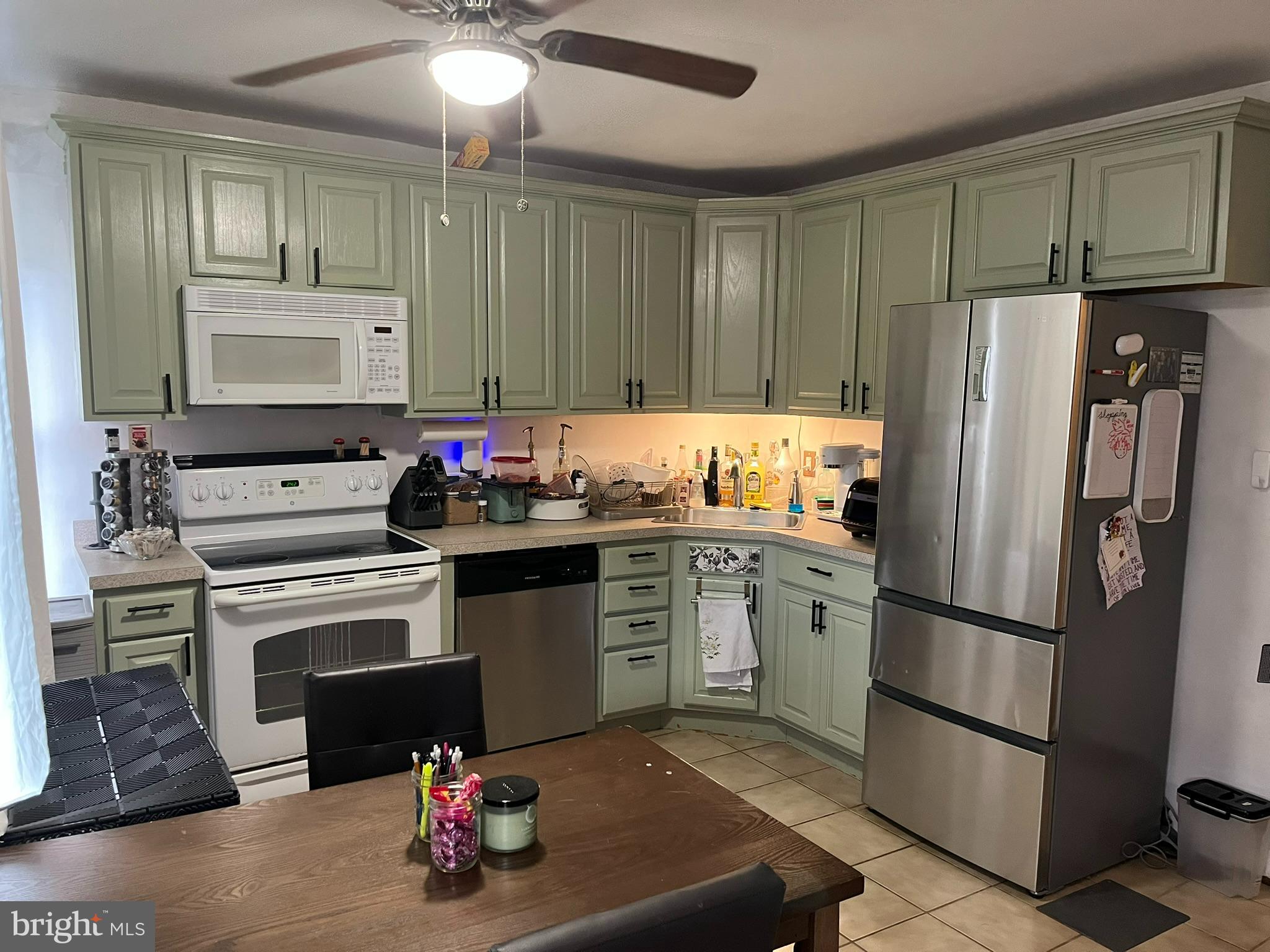 227 Ridge Road Claymont, DE 19703 - Photo 3 of 18 a kitchen with a refrigerator stove and sink
