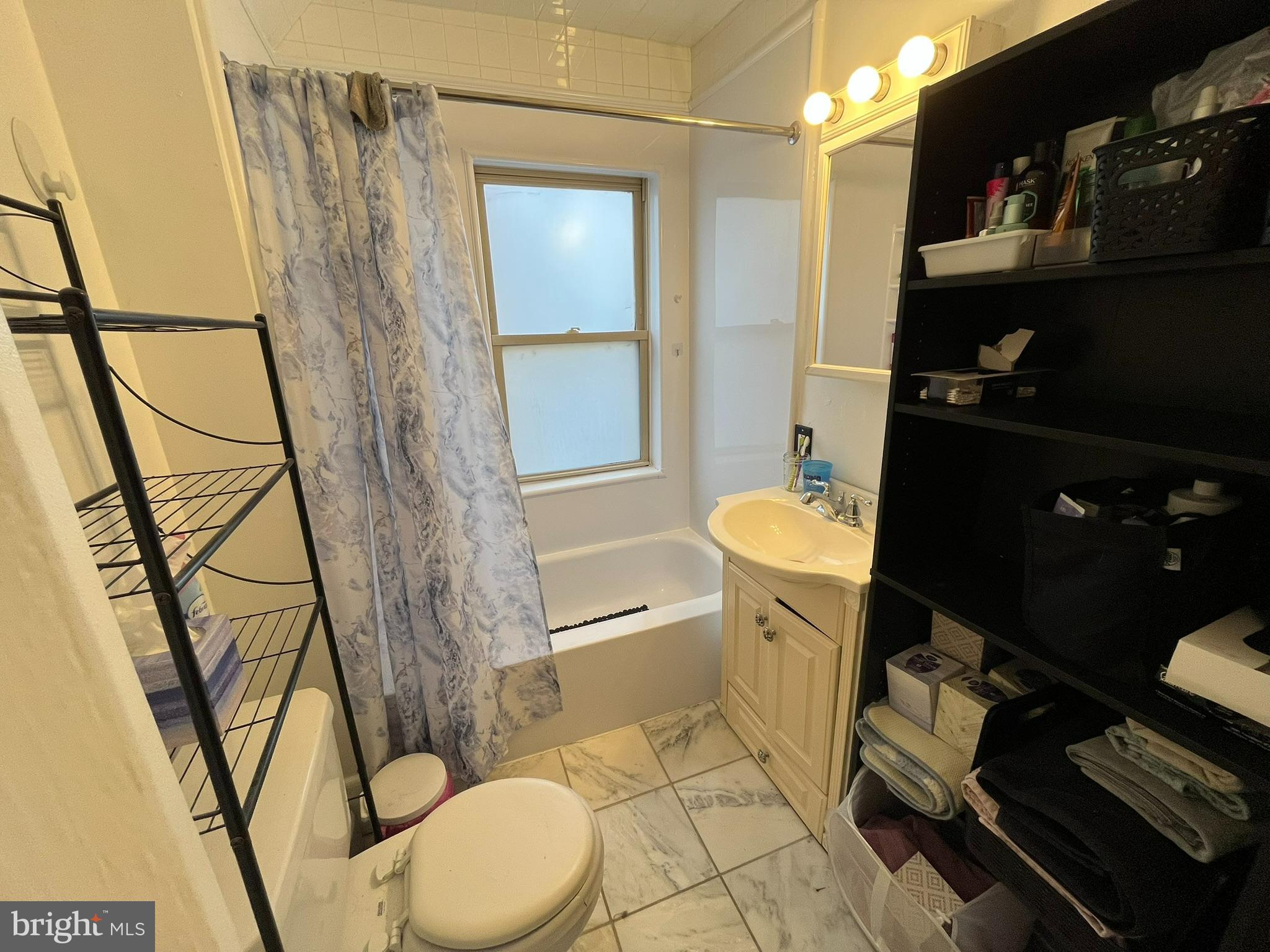 227 Ridge Road Claymont, DE 19703 - Photo 10 of 18 a bathroom with a sink toilet and shower