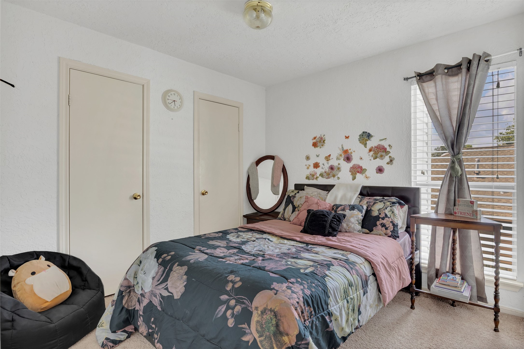 15619 Beechnut Street Houston, TX 77083 - Photo 17 of 29 Comfortable secondary bedroom with natural light, fresh 2024 carpet, and generous closet space.