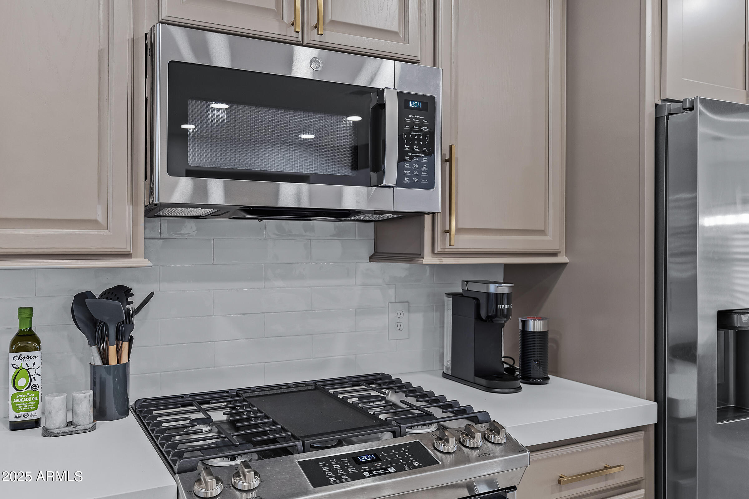 7308 North 7th Avenue Phoenix, AZ 85021 - Photo 15 of 42 a kitchen with a stove and a microwave