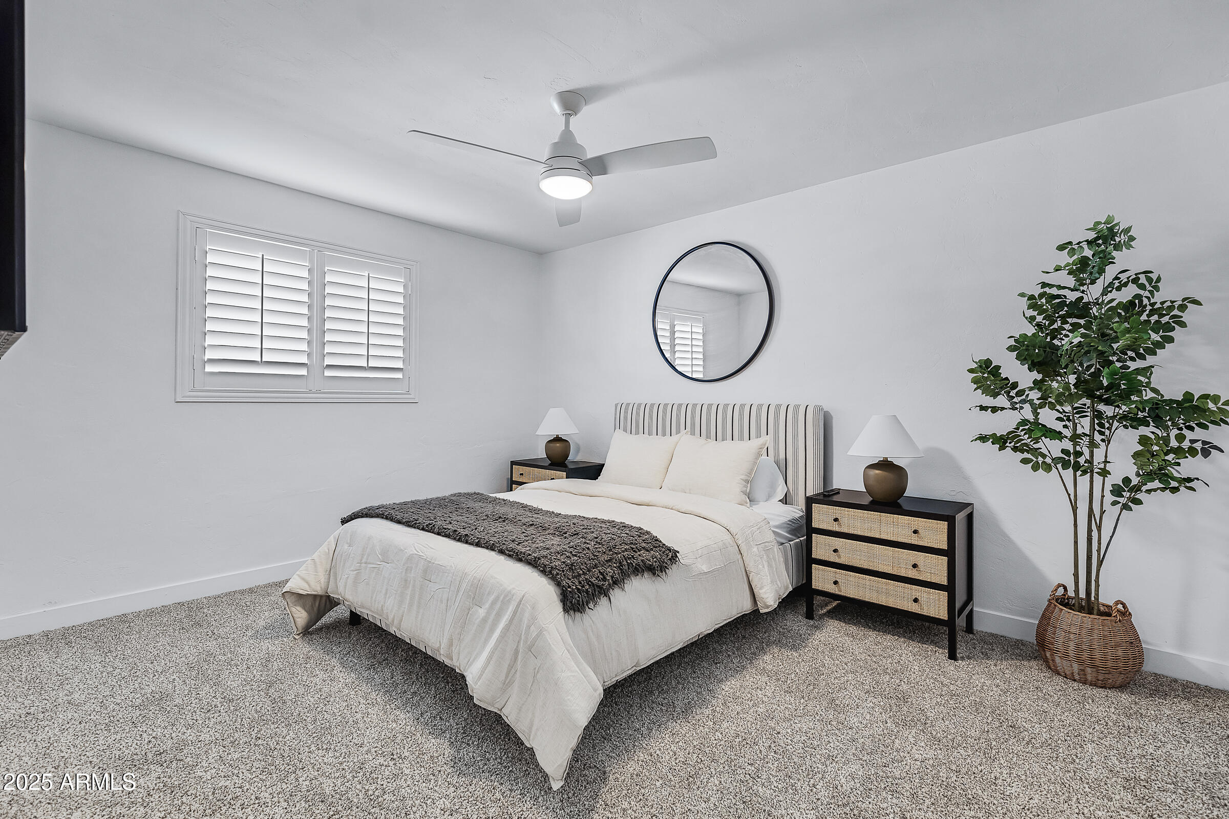 7308 North 7th Avenue Phoenix, AZ 85021 - Photo 23 of 42 a bedroom with a bed and a potted plant