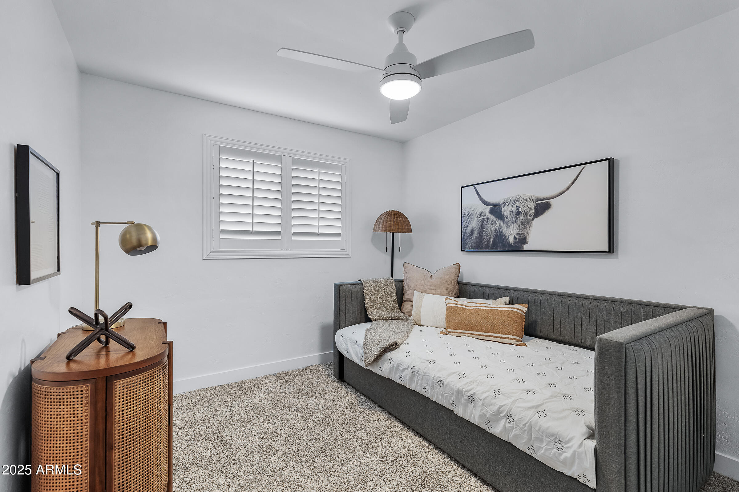 7308 North 7th Avenue Phoenix, AZ 85021 - Photo 26 of 42 a bedroom with a bed and a chandelier