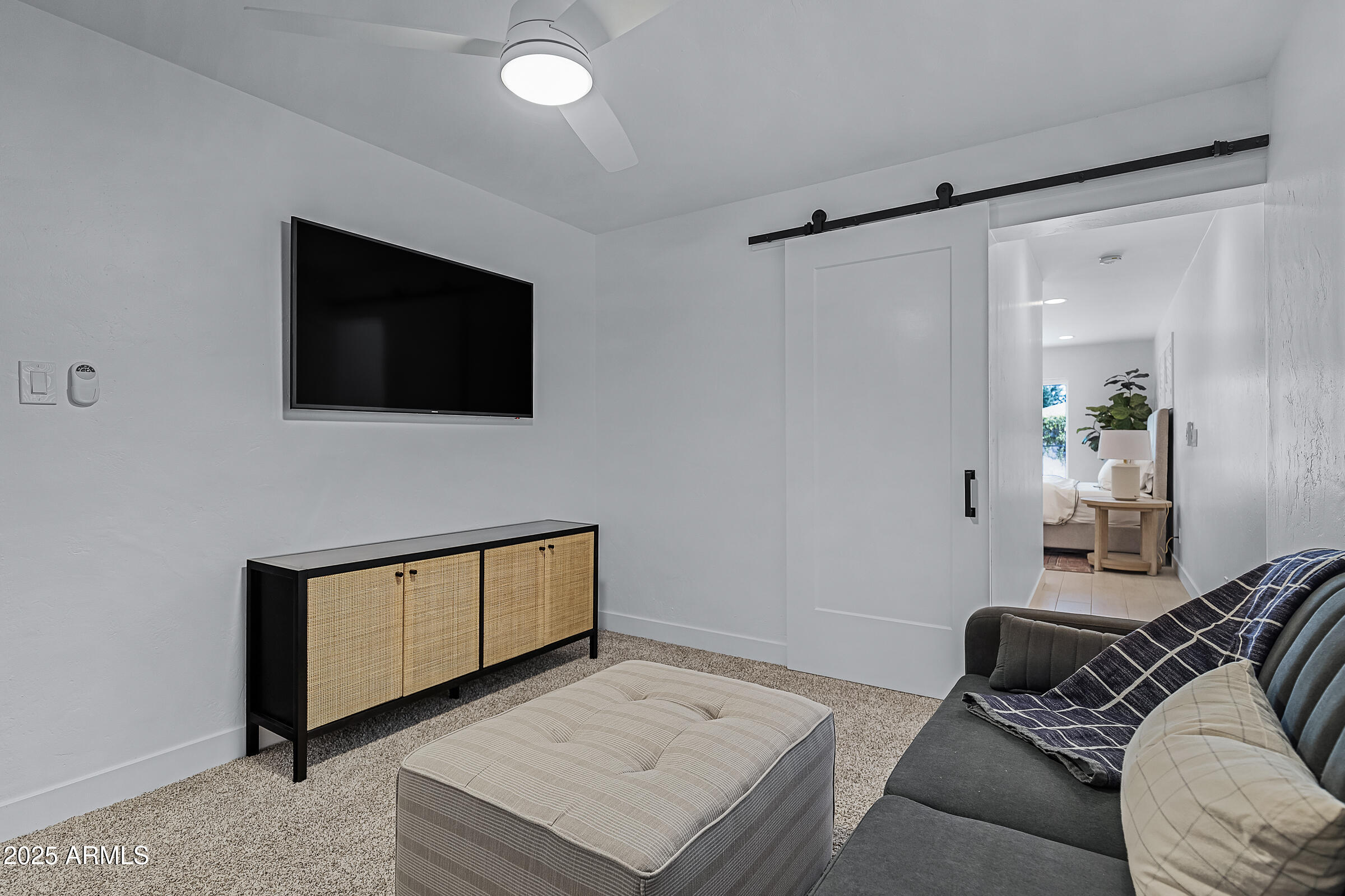 7308 North 7th Avenue Phoenix, AZ 85021 - Photo 29 of 42 a bedroom with a bed and a flat screen tv