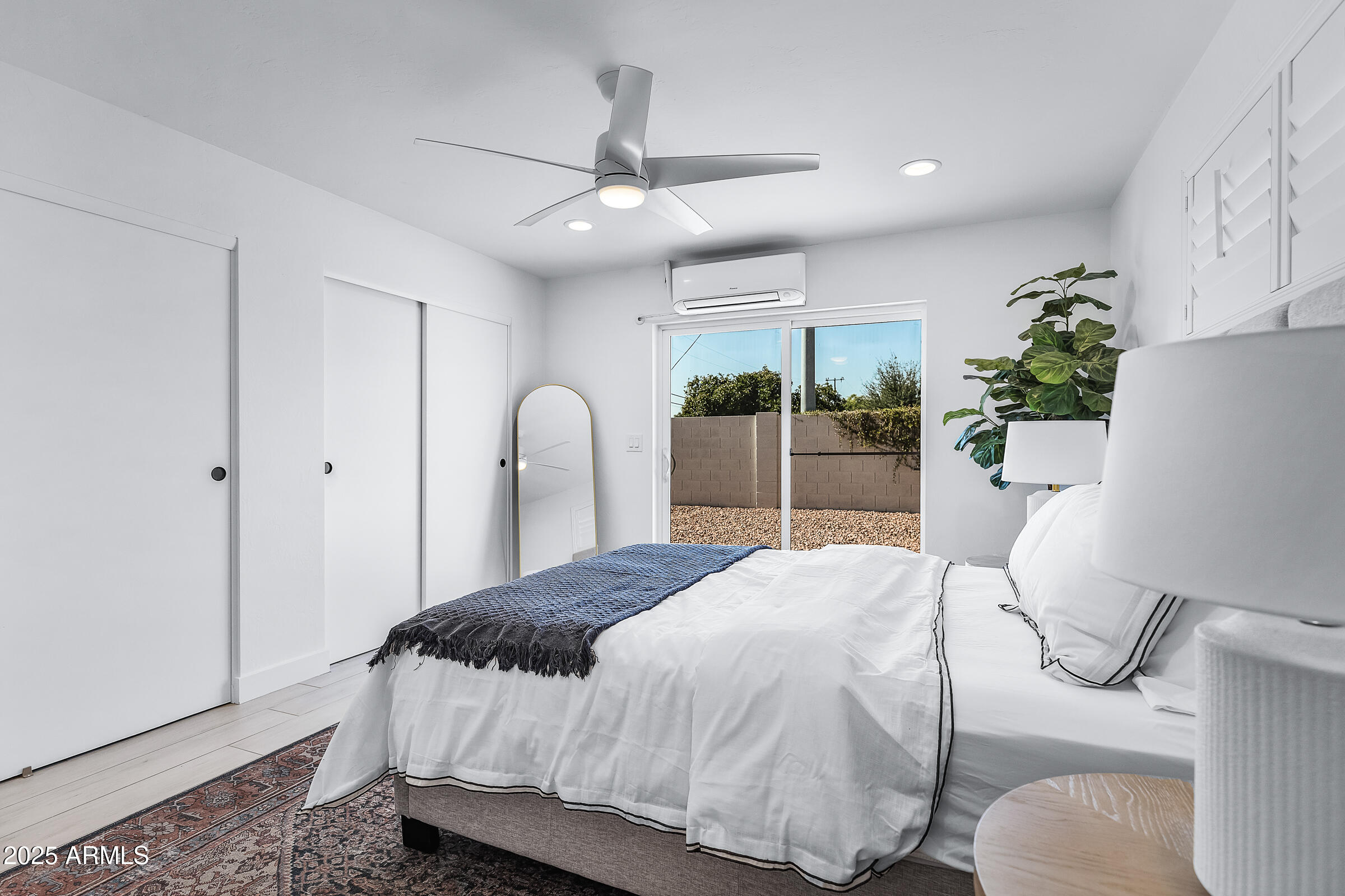 7308 North 7th Avenue Phoenix, AZ 85021 - Photo 30 of 42 a bedroom with a bed window and potted plant
