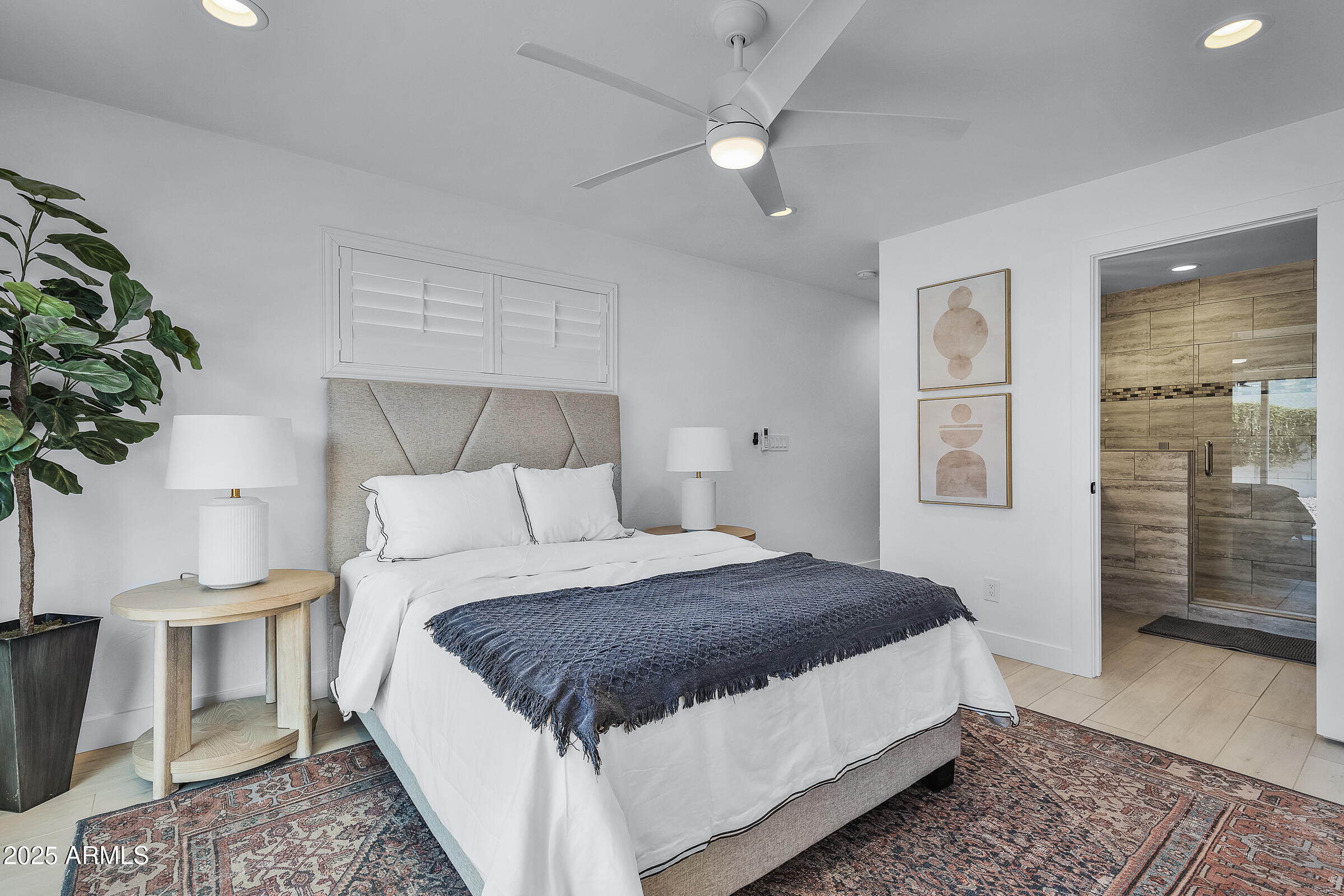 7308 North 7th Avenue Phoenix, AZ 85021 - Photo 31 of 42 a bedroom with a large bed and a chandelier