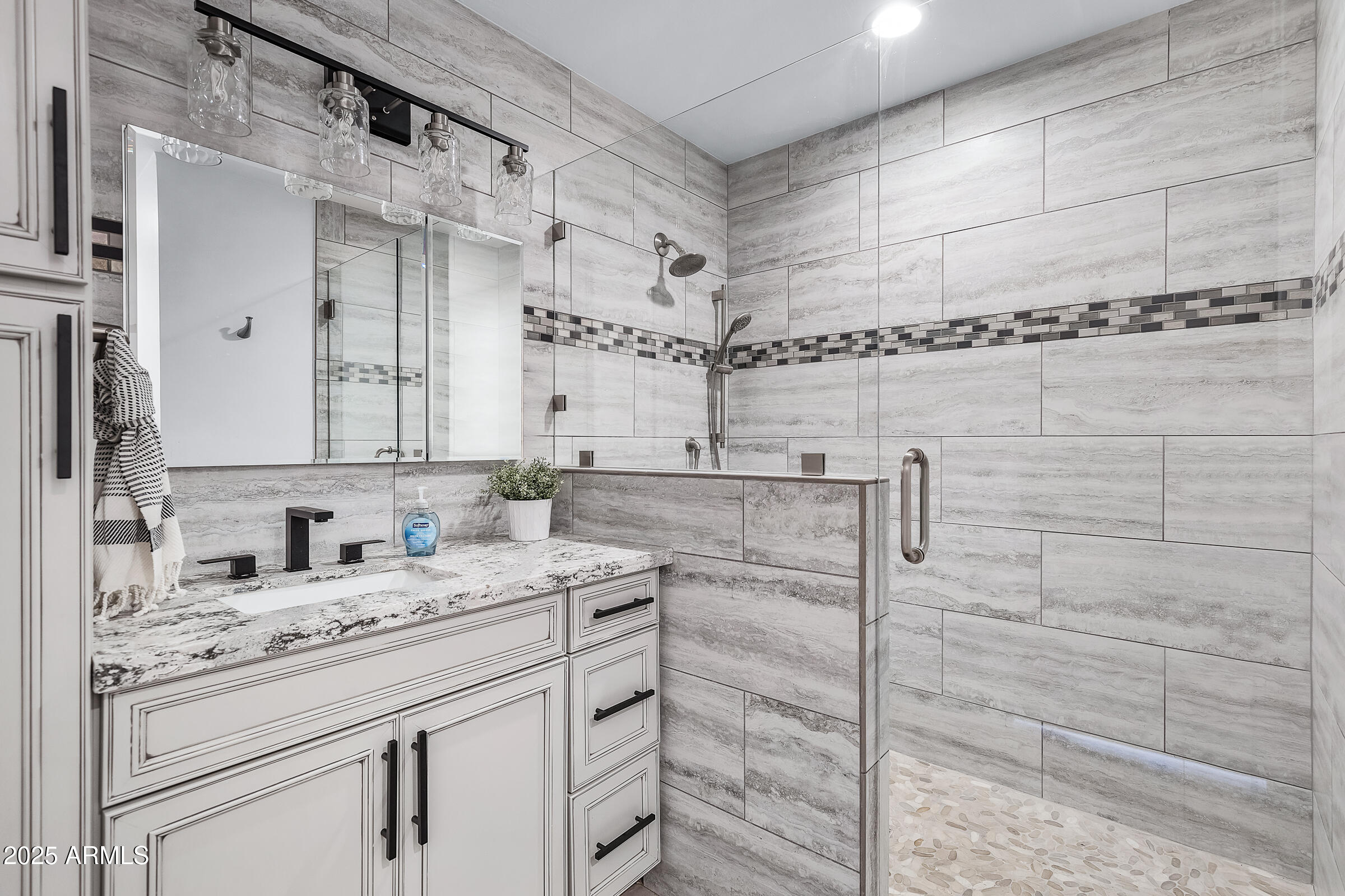 7308 North 7th Avenue Phoenix, AZ 85021 - Photo 33 of 42 a bathroom with a granite countertop sink a mirror and shower