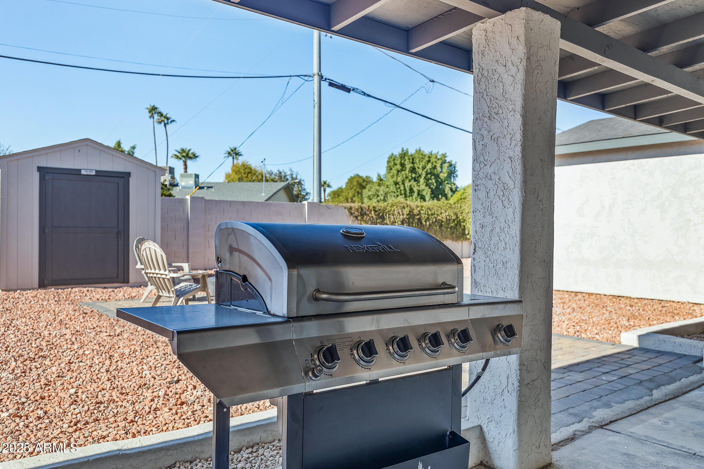 7308 North 7th Avenue Phoenix, AZ 85021 - Photo 41 of 42 a living room with stainless steel appliances kitchen island granite countertop furniture and a fireplace
