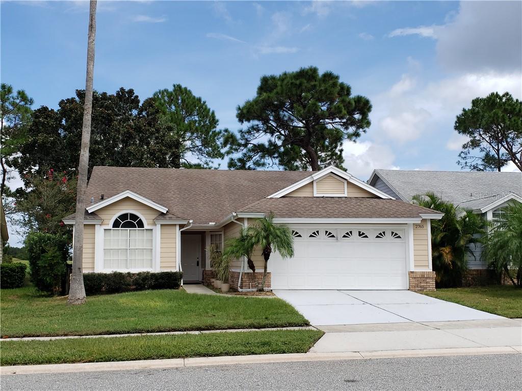 2765 Falling Tree Circle Orlando, FL 32837 - Photo 1 of 1 a front view of a house with a yard and garage
