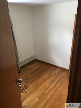 3 Brookville Road Edison, NJ 08817 - Photo 14 of 19 an empty room with wooden floor