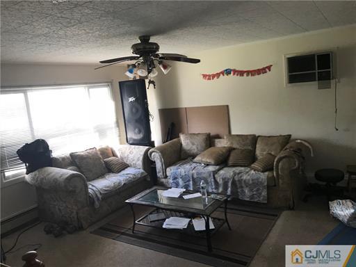 3 Brookville Road Edison, NJ 08817 - Photo 5 of 19 a living room with furniture and a window