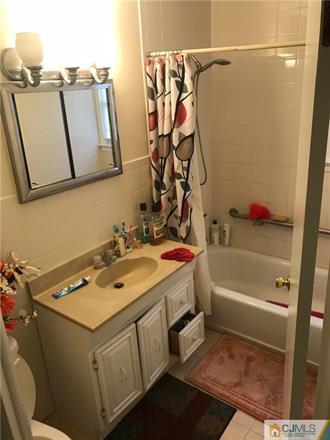 3 Brookville Road Edison, NJ 08817 - Photo 9 of 19 a bathroom with a sink a toilet and a bathtub