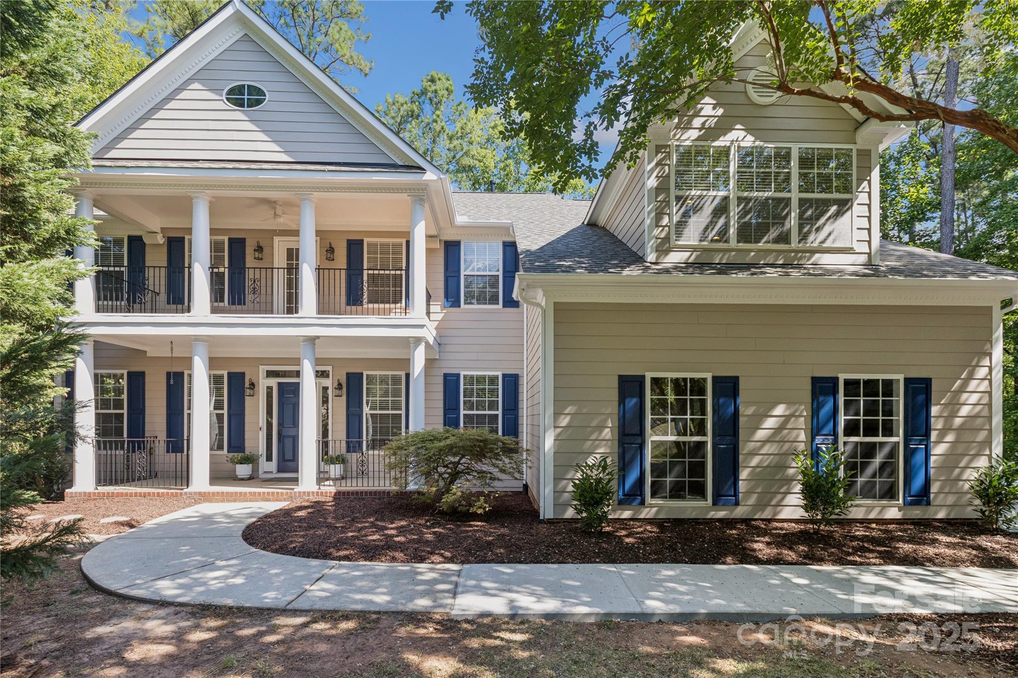 1627 Scotch Pine Lane Tega Cay, SC 29708 - Photo 1 of 48 a front view of a house with garden