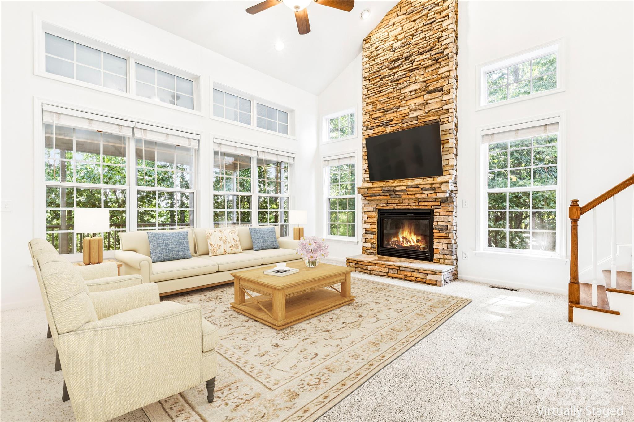 1627 Scotch Pine Lane Tega Cay, SC 29708 - Photo 13 of 48 a living room with furniture large window and a fireplace