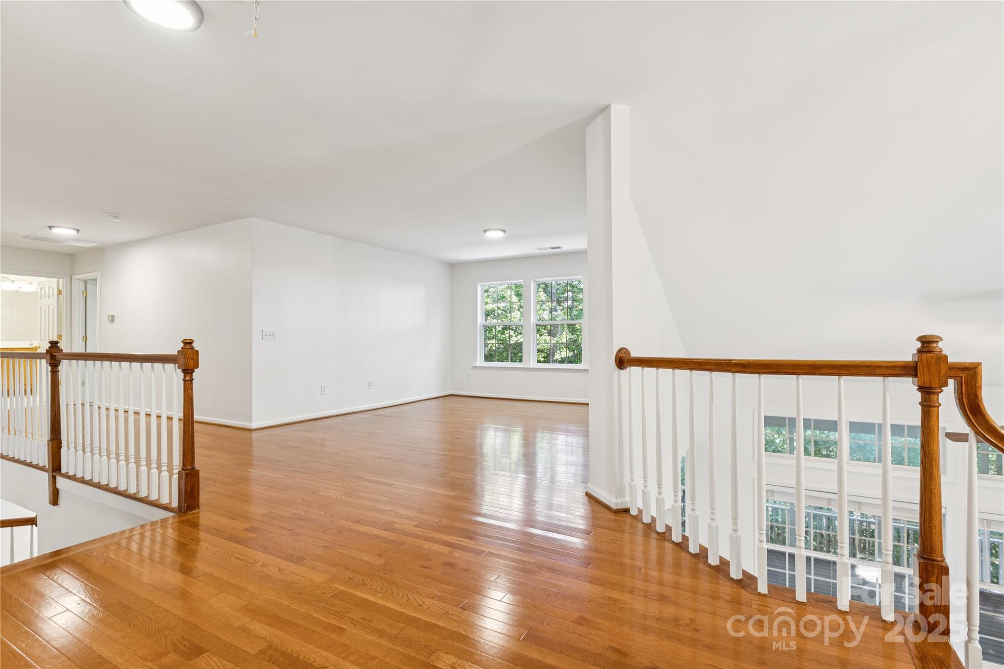 1627 Scotch Pine Lane Tega Cay, SC 29708 - Photo 24 of 48 a view of an empty room with wooden floor
