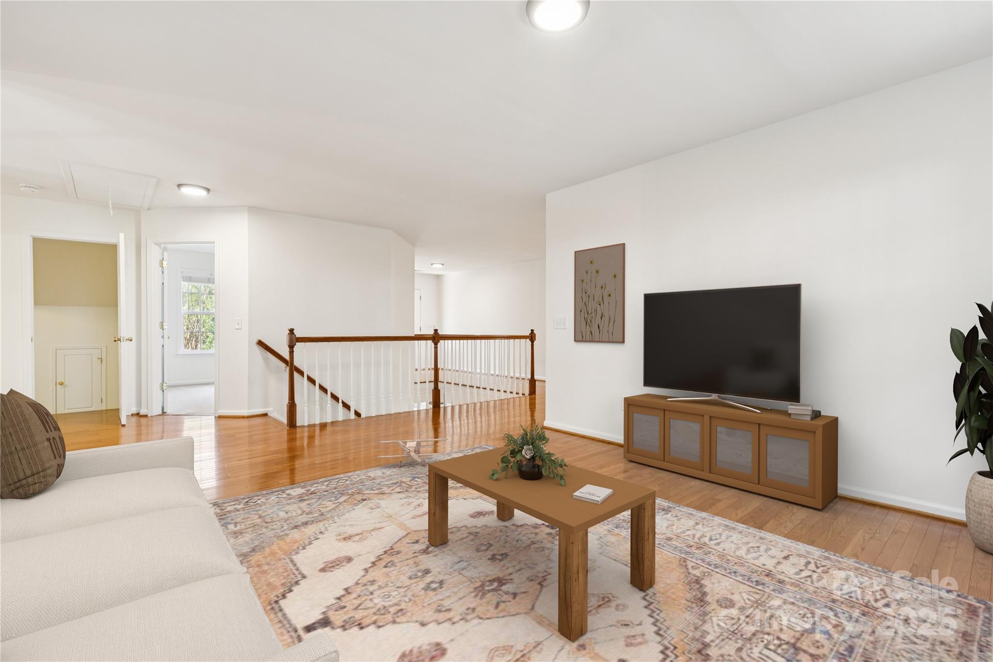1627 Scotch Pine Lane Tega Cay, SC 29708 - Photo 25 of 48 a living room with furniture and a flat screen tv