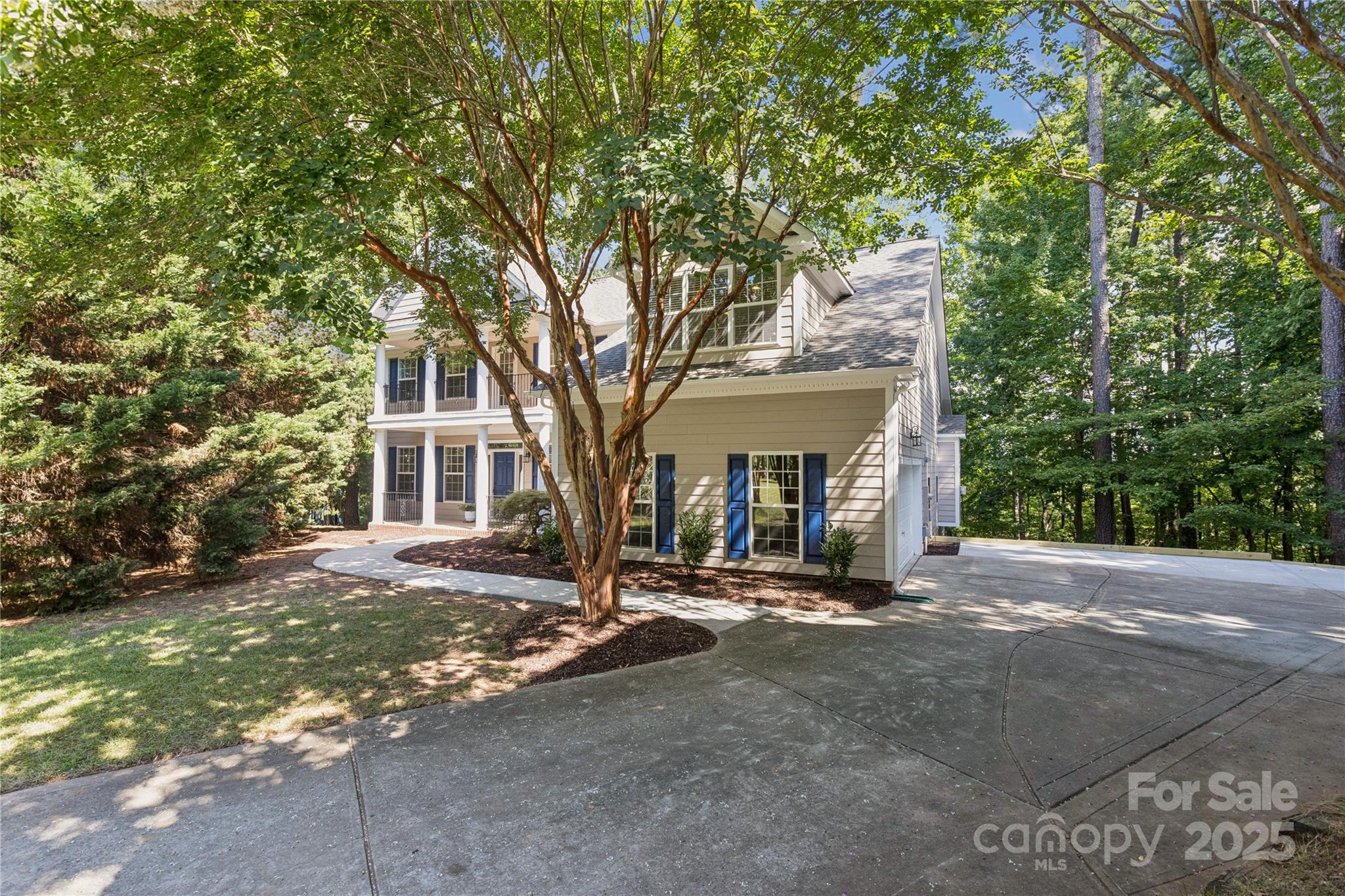 1627 Scotch Pine Lane Tega Cay, SC 29708 - Photo 3 of 48 a view of a house with a tree in front of it