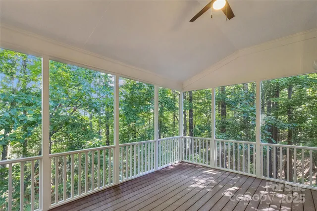 a view of a balcony with wooden floor