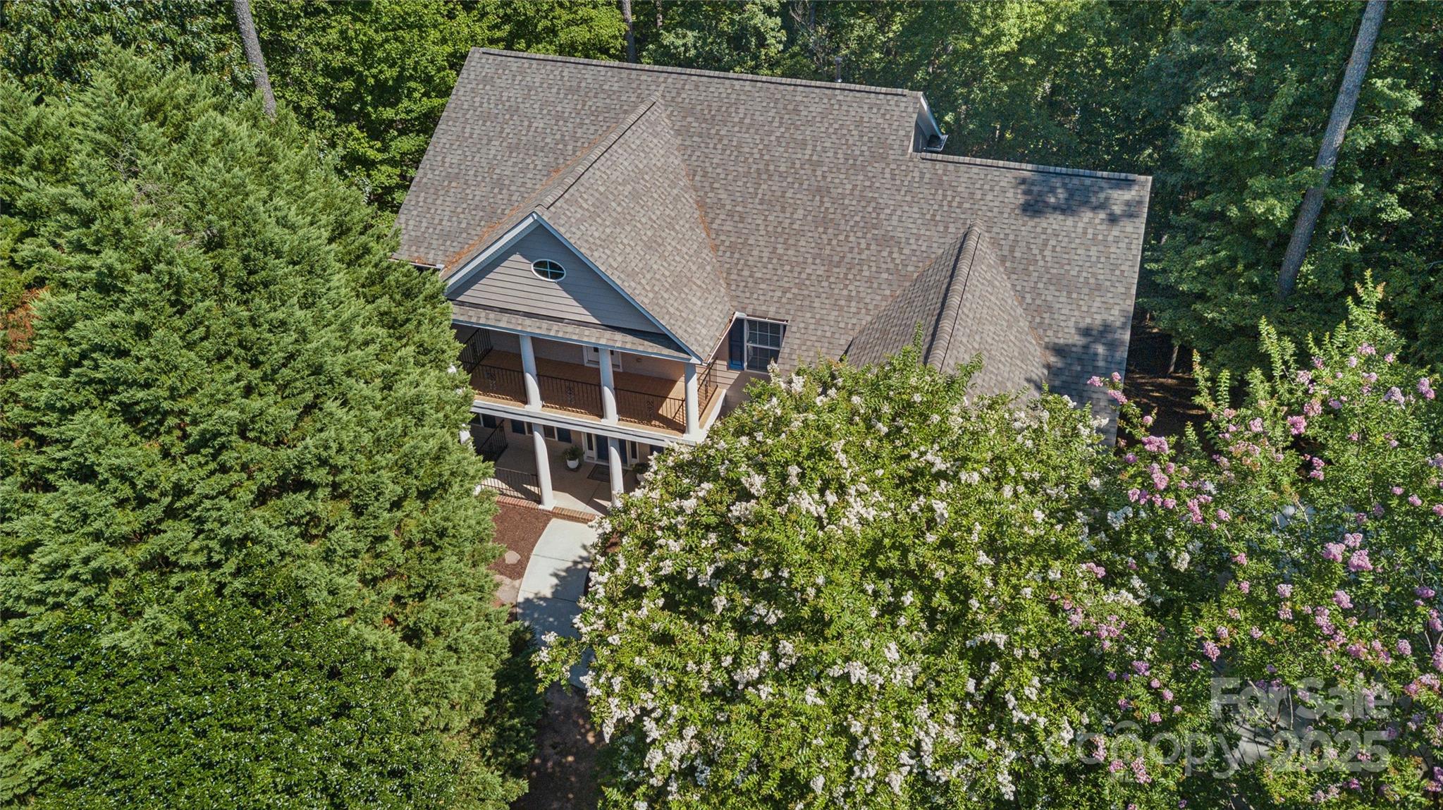 1627 Scotch Pine Lane Tega Cay, SC 29708 - Photo 45 of 48 an aerial view of house with yard and trees in the background