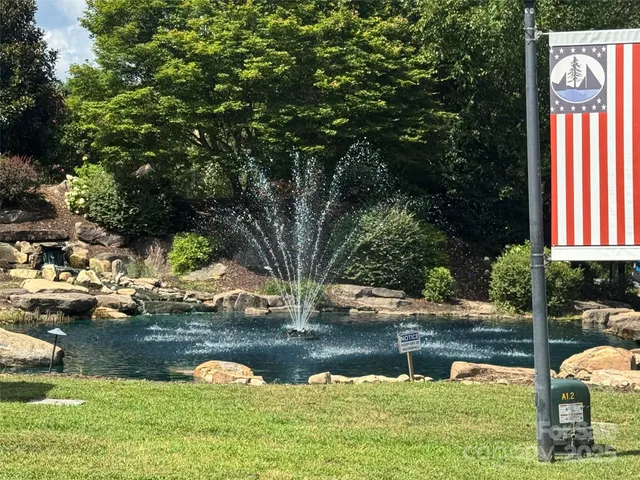 a view of swimming pool with a yard