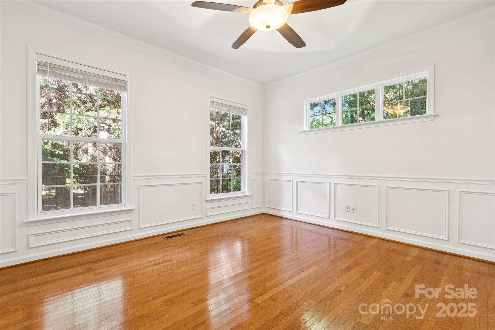 1627 Scotch Pine Lane Tega Cay, SC 29708 - Photo 5 of 48 a view of an empty room with a window and wooden floor