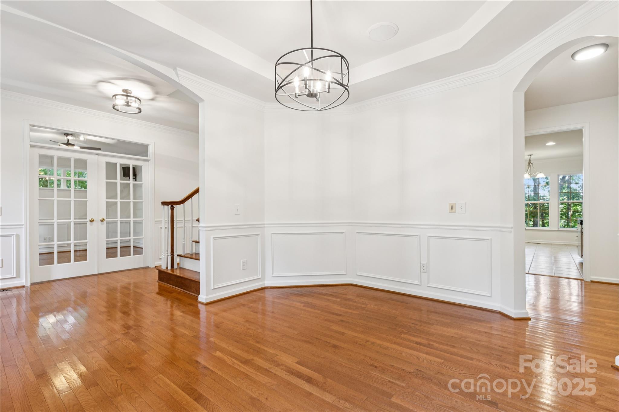 1627 Scotch Pine Lane Tega Cay, SC 29708 - Photo 8 of 48 a view of a room with wooden floor and white walls