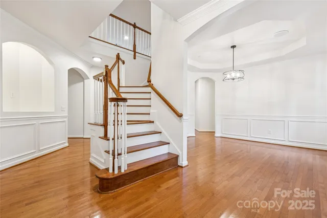 a view of entryway with wooden floor