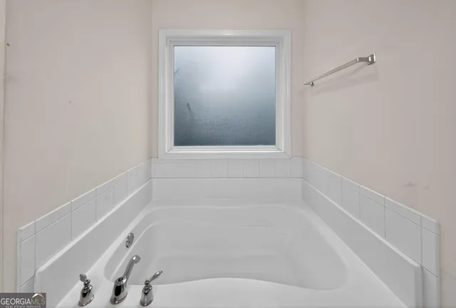 a close up of a bathtub in a bathroom