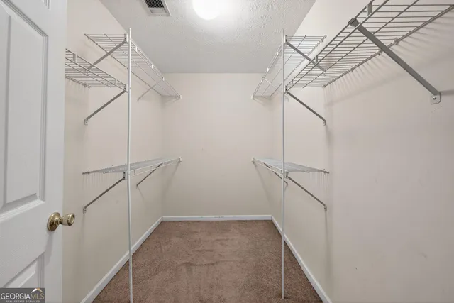 a view of a room with racks on the wall