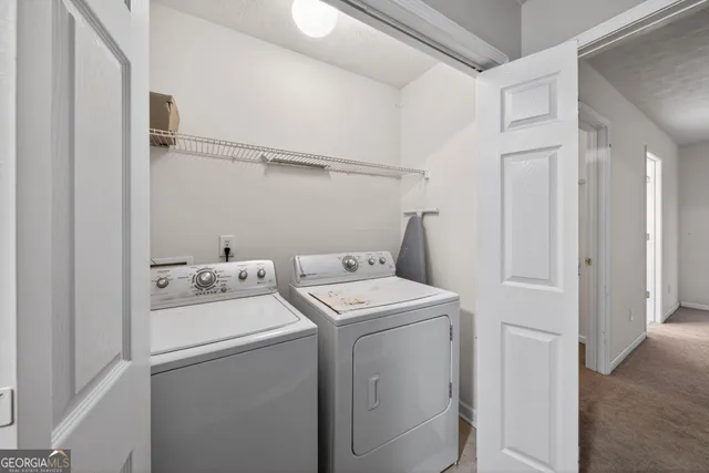 a utility room with dryer and washer