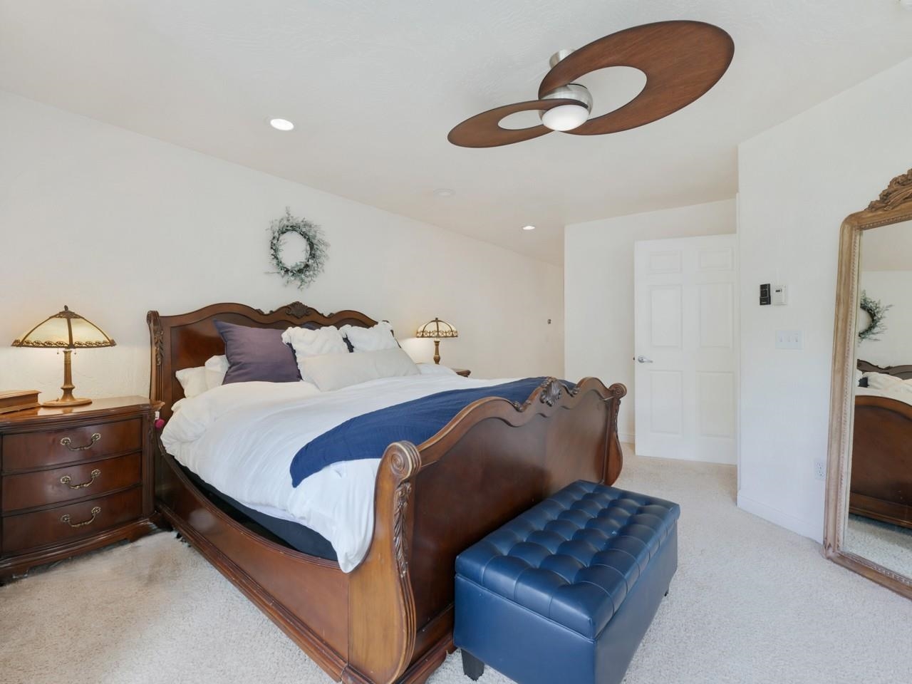 2433 H Road Grand Junction, CO 81505 - Photo 18 of 42 a bedroom with a bed and a chandelier