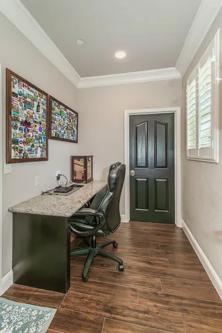 a workspace with furniture and window