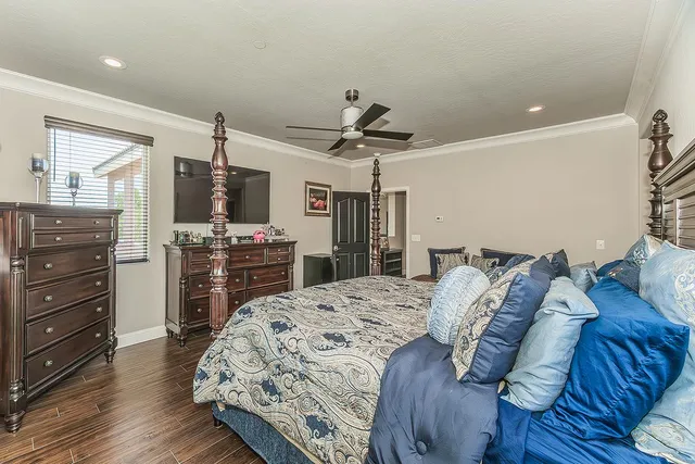 a bed room with a bed and a television