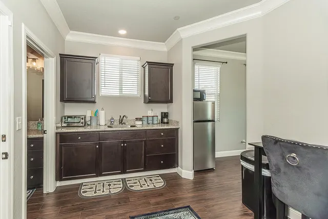 a kitchen with a dining table and chairs