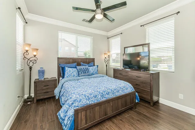 a living room with a flat screen tv and a rug