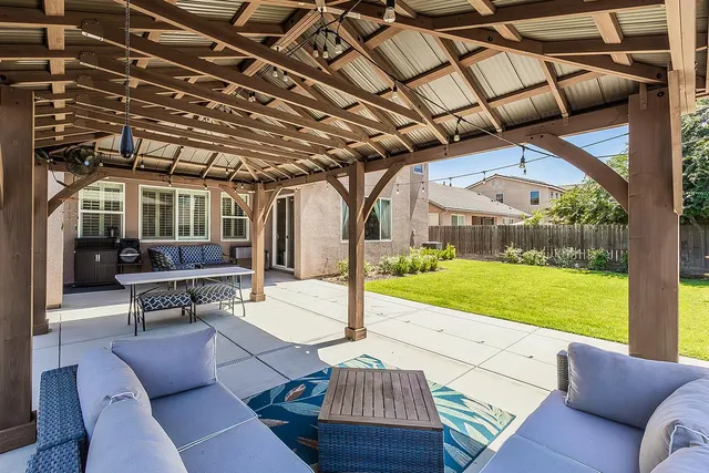 a view of yard with patio