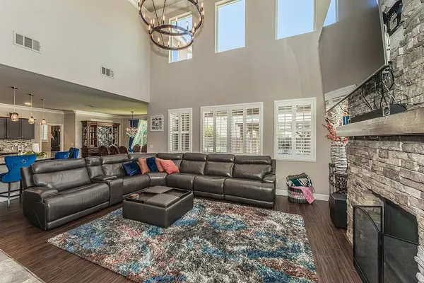 a kitchen with stainless steel appliances granite countertop a refrigerator a stove and a sink