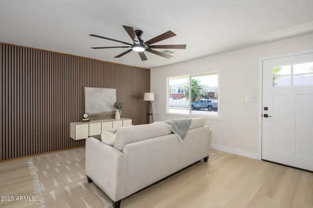 a living room with furniture and a window