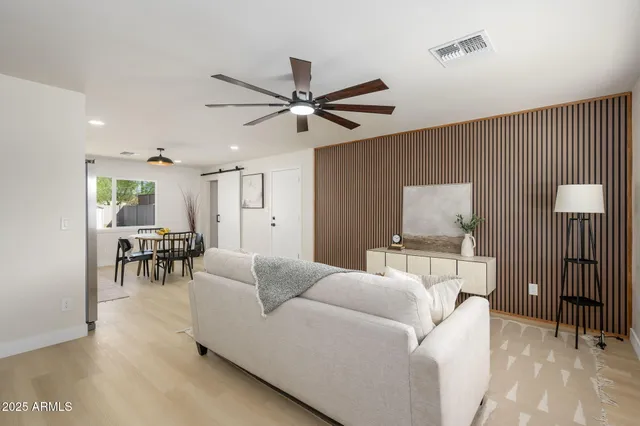 a living room with furniture and a table