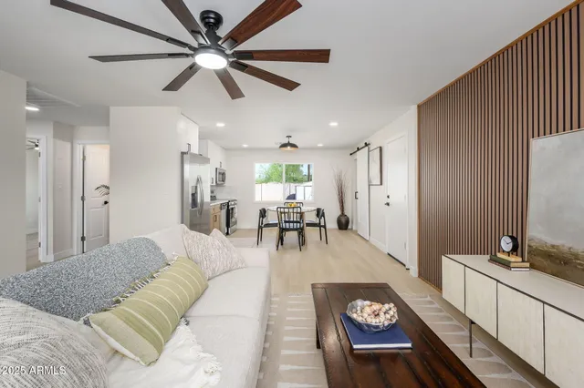 a living room with furniture and a table