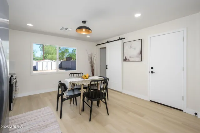 a view of a dining room with furniture window and outside view