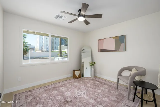 a workspace room with furniture and windows