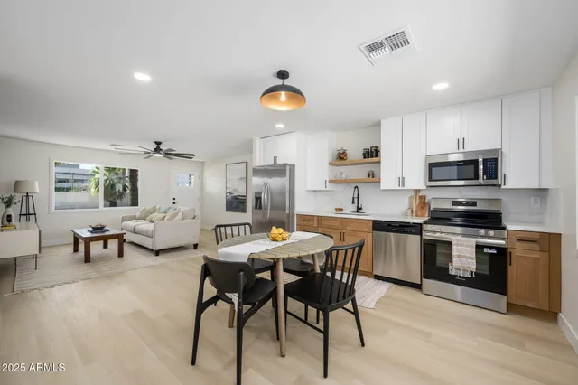 a view of kitchen with cabinets and wooden floor