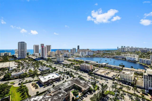 a room with furniture a flat screen tv and a large window