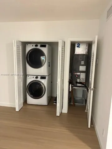 a view of a kitchen with a washer and dryer