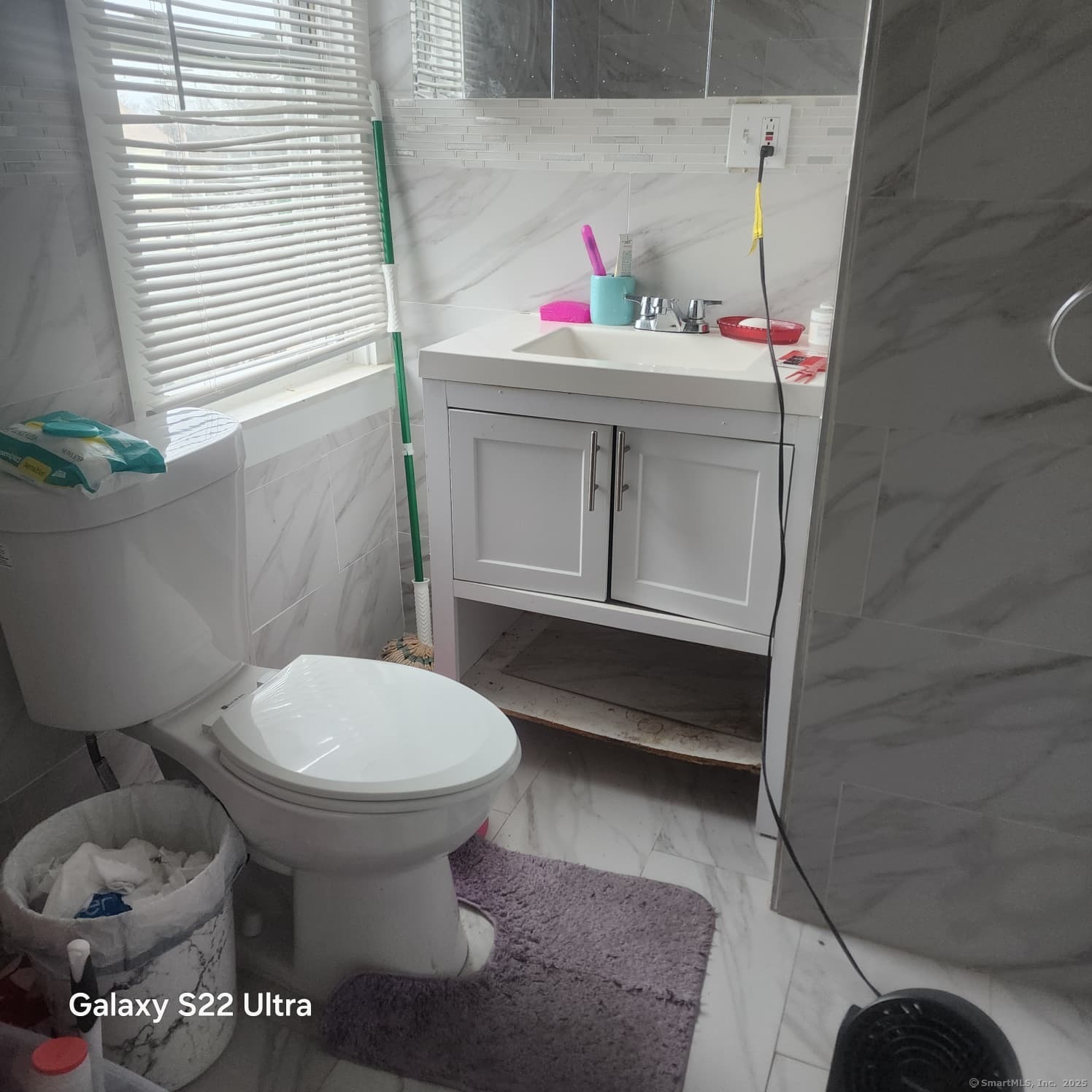 68 Edwin Street Bridgeport, CT 06607 - Photo 12 of 23 a bathroom with a toilet and a sink