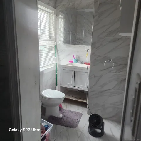 a bedroom with a bed and a table